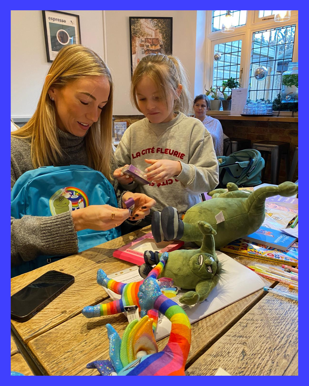 Mother and daughter  exploring  The Booster Way Transformation Toolkit.