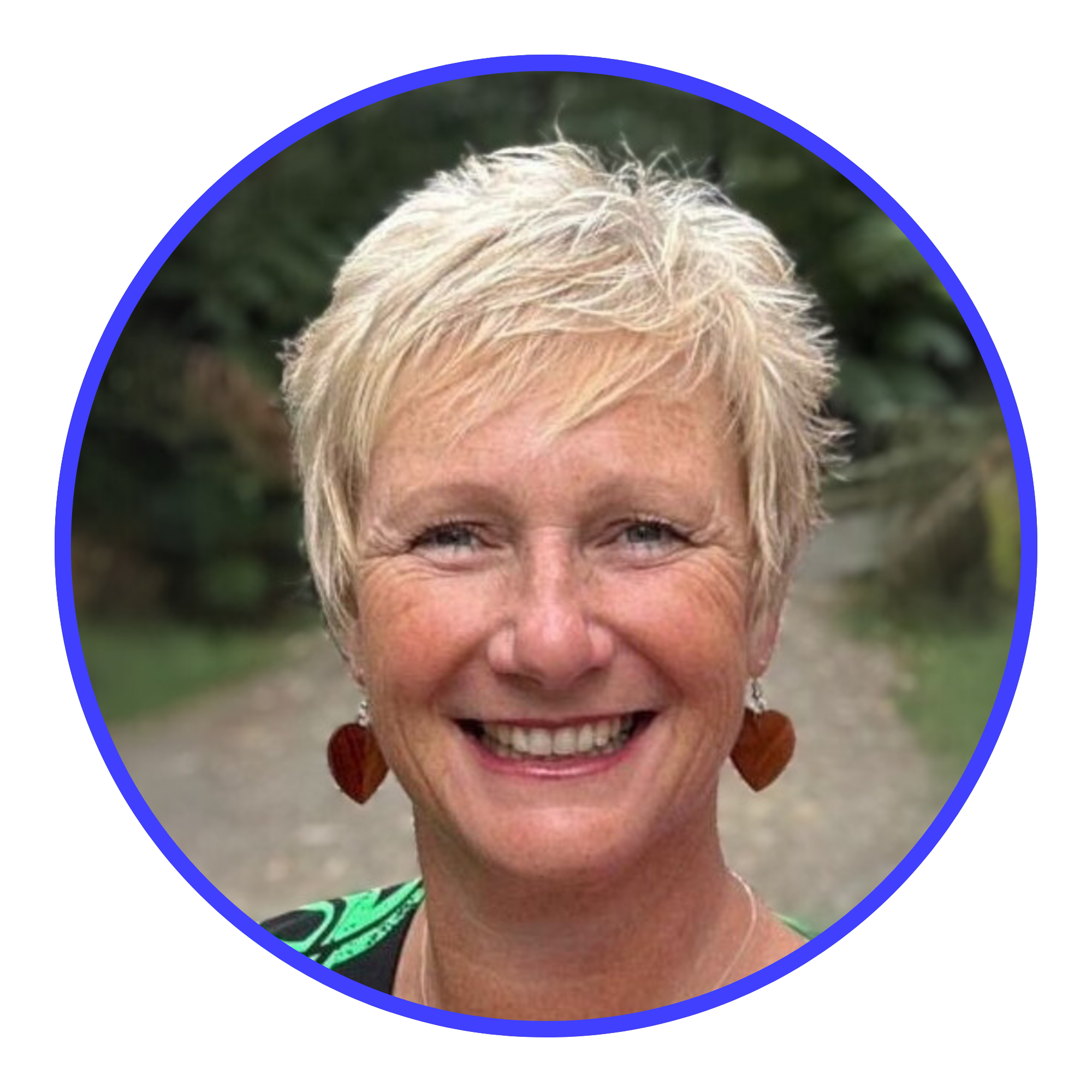 Kathryn Lovewell smiling outdoors, surrounded by a blue border.